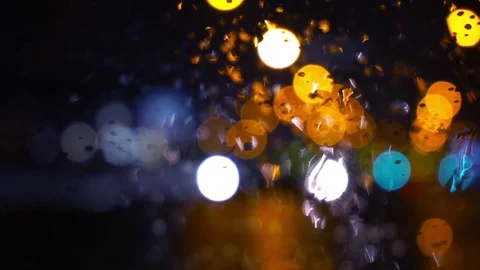 Wet the window with the background of the night city traffic view Stock Footage 70223414