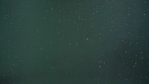 Wet window glass surface during rainy weather macro Stock Footage 119017375