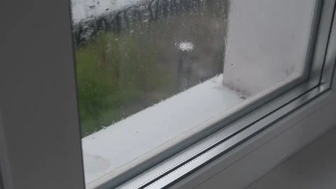 Wet Window Pane with Rain Streaks and Condensation Stock Footage 308851706