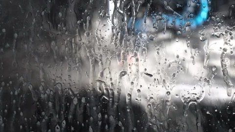 Wet window of a working cnc milling machine with dripping drops Stock Footage 120012288
