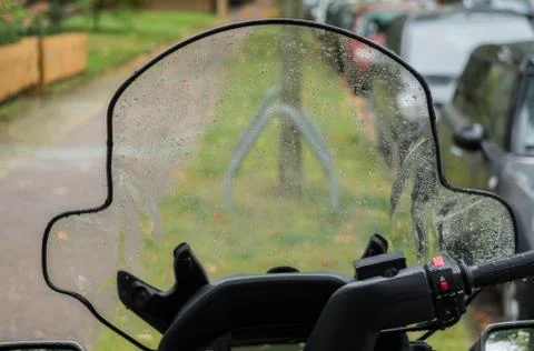 Wet windshield of a scooter Stock Photos