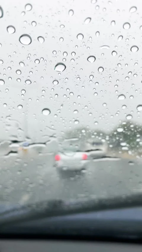 Wet windshield with windshield wipers running Stock Footage 292025093