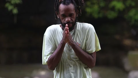 A Wet Young Man With Dreadlocks Freezing in the Middle of a River Stock Footage 209136242