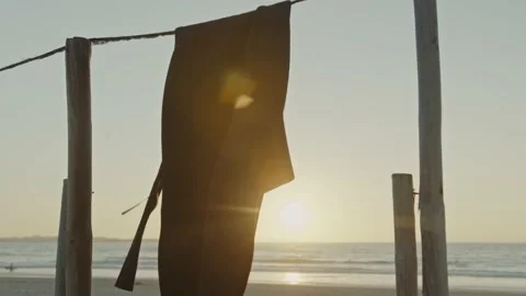 Wetsuit at sunset wind Stock Footage 228386163