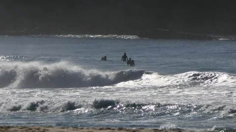 Wetsuit surfers1 Stock Photos