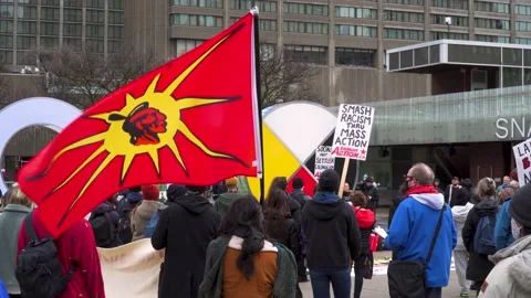 Wet'suwet'en Supporter With A Mohawk Warrior Flag At A Rally In Toronto Stock Footage 167047352