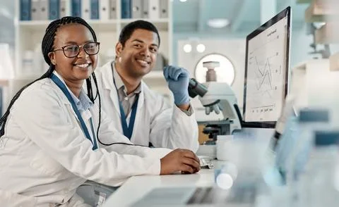 Weve been assigned a new case to solve. Portrait of two scientists working Stock Photos