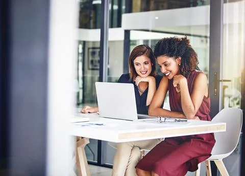 Weve plotted the plan, now lets watch what happens. two young businesswomen Fotos de archivo