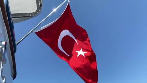 Weving Turkish flag at blue sky Stock Footage 213618234