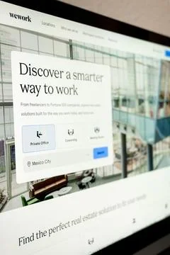 Wework website displaying coworking and pr.. Stock Photos