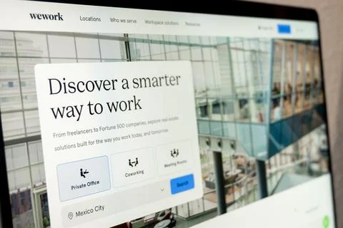 Wework website displaying coworking Stock Photos