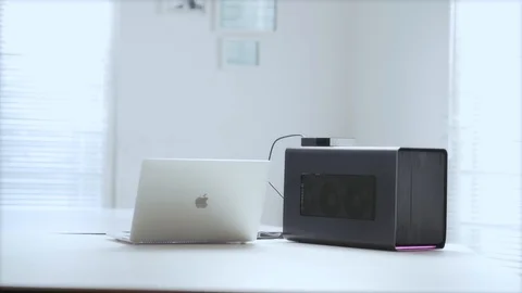 WFH DAY 47-work desk with a laptop and an external gpu. Video stock 129727092