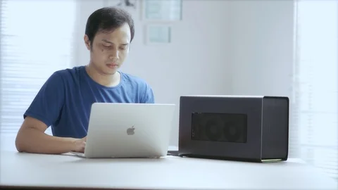 WFH DAY 51-an asian young working remote, working from home with his laptop Video stock 129727504