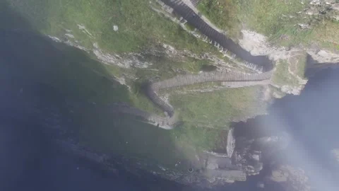 Whaligoe steps in Lybster Sutherland drone aerial video Stock Footage 247350754