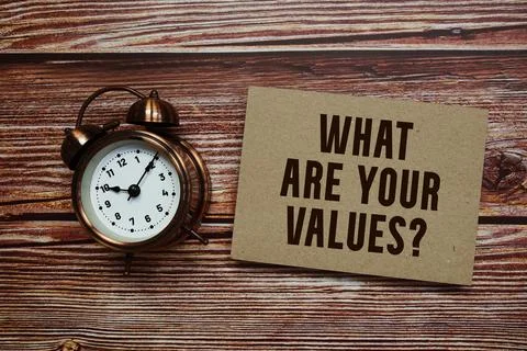 What Are Your Values? text with alarm clock on wooden background 스톡 사진