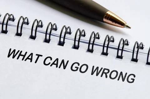 What can go wrong text on white notepad. Business or auditing concept Stock Photos