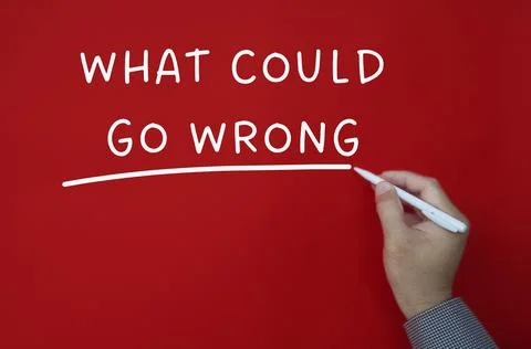 What could go wrong text on red cover background. Foto stock