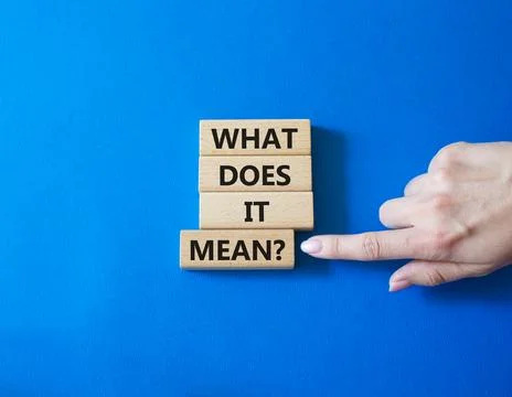 What does it mean symbol. Wooden blocks with words What does it mean. Busin.. Stock Photos