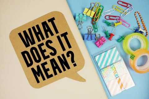 What Does It Mean? text with stationery on cover notebook background Foto stock