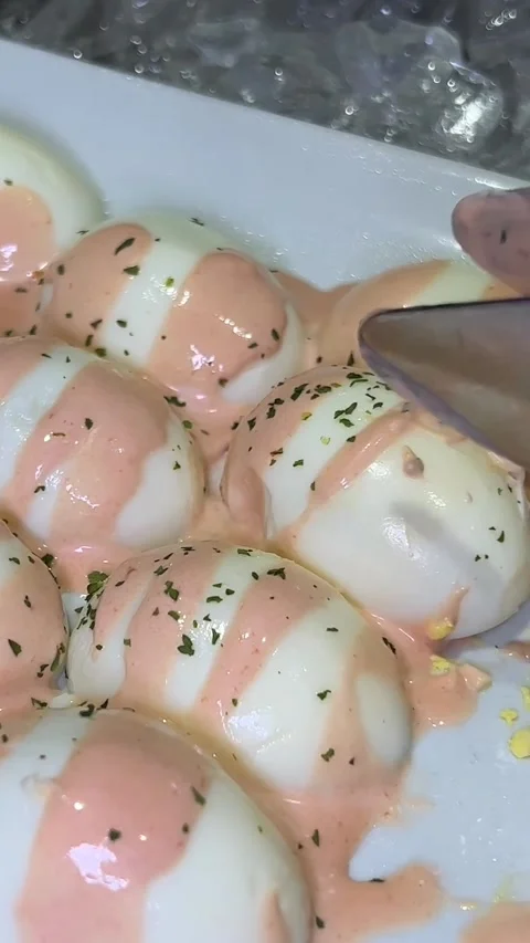 What a festive table without stuffed eggs, add piquancy in the form of red Stock Footage 246519196