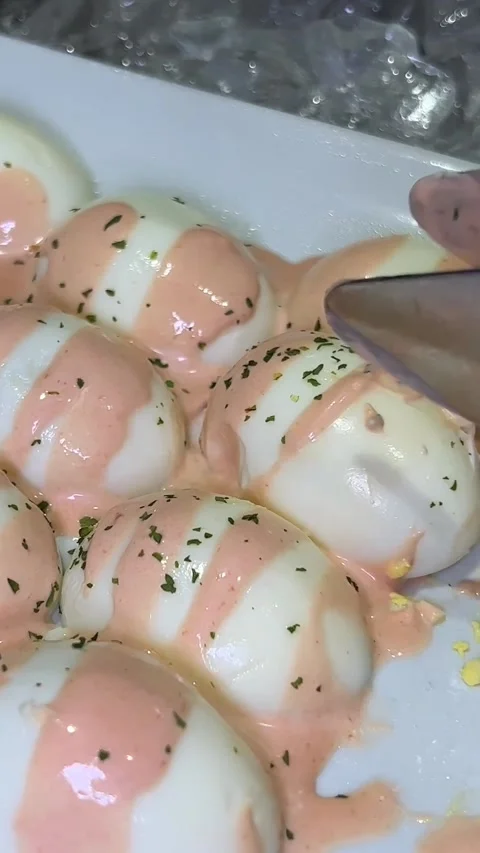 What a festive table without stuffed eggs, add piquancy in the form of red Stock Footage 250801510