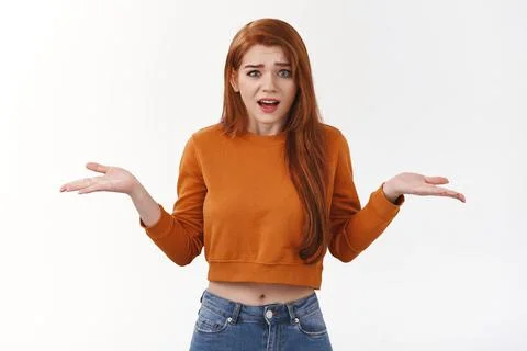What I do wrong. Confused annoyed redhead girlfriend complaining strange Stock Photos