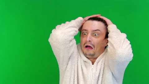 What is it. Puzzled, baffled or puzzled, curious man ruffled his hair in white Stock-Footage 124936778