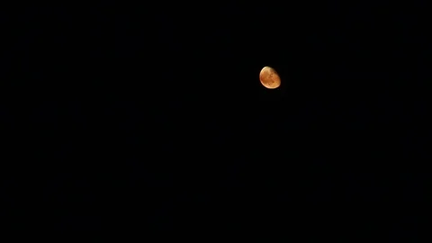 What the moon looks like with a brush fire below Stock Footage 109207614