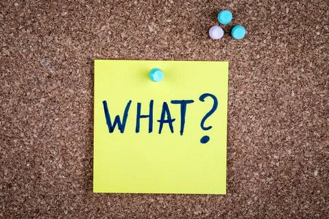 What. Question concept. Text on a sticky note pinned to a corkboard Stock Photos