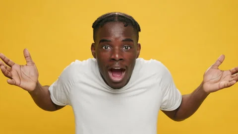 What So what surprised black young African American man raising his hands up Stock Footage 154004250