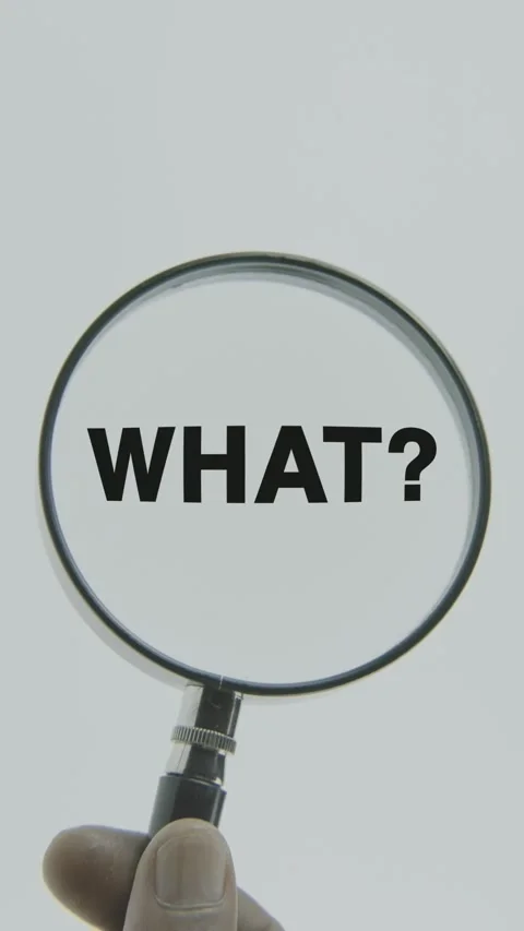 What text or word highlighted by a magnifying glass in a hand on a white Stock Footage 303528560
