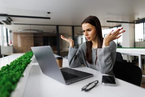 What is wrong. Anxious angry hispanic female splash hands unable to access da Stock Photos