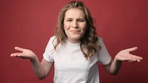 What wrong. Portrait of confused beautiful girl with curly hair. Stock Footage 138742448