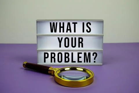 What Is Your Problem? text on LED lightbox with magnifying glass on purple Stockfoto's
