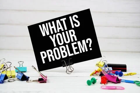 What Is Your Problem? text on paper card with stationary on wooden background Stock Photos