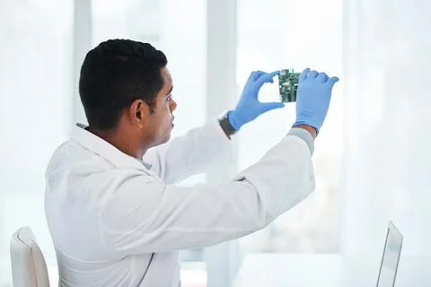 Whatevers wrong, hell make it right. a young man repairing computer hardware in Stock Photos