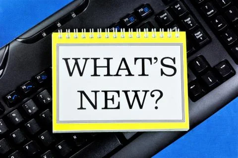 What's new? - text message in Notepad on the PC keyboard. Stock Photos