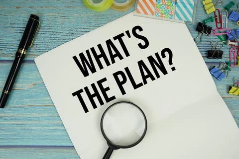 What's The Plan? text on a paper surrounded by office supplies and magnifyi.. Fotos de archivo