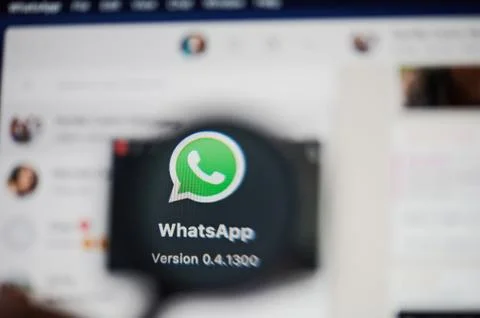 Whatsapp application icon view throw magnifier Stock Photos