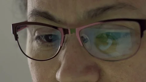 Whatsapp Logo Reflection in Glasses of Middle Aged Female Stock Footage 74997205