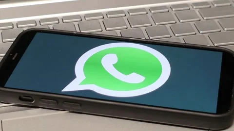 WhatsApp mobile app logo displayed on mobile phone Stock Footage 324705948