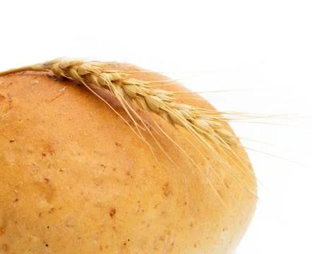 Wheat and bread on a white background Stock Photos