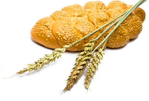 Wheat and bread on white background Stock Photos