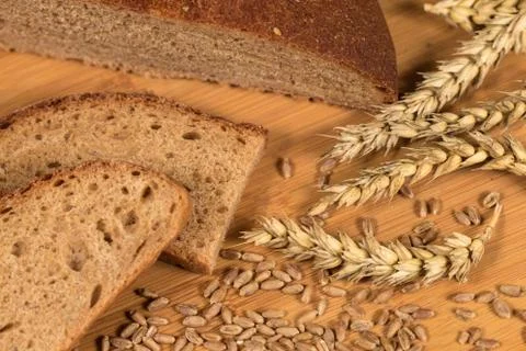 Wheat Bread And Grain Ears Background Stock Photos