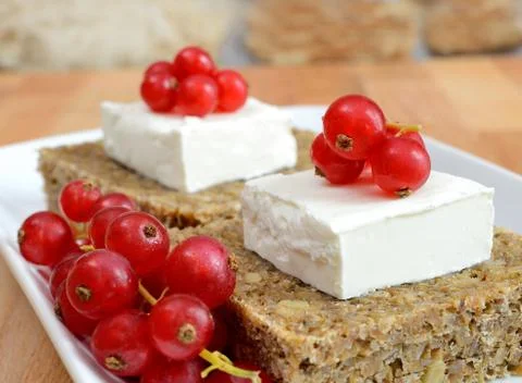 Wheat bread cheese and red fruit Stock-Fotos