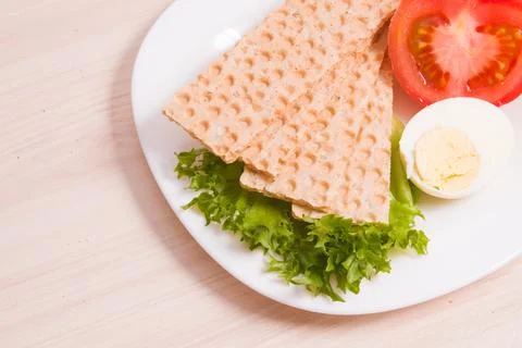 Wheat bread crisps on a plate, proper and healthy nutrition concept, dietetic Stock Photos