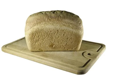Wheat bread on cutting board on white Foto stock