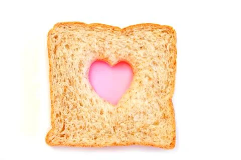 Wheat Bread Slice with heart Isolated on White Foto stock