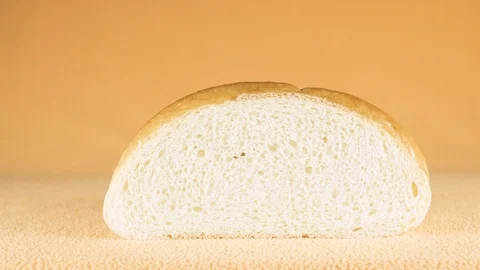 Wheat bread. Unusual camera movement from close-up to general video plan Video stock 103957928