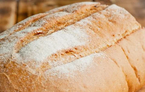 Wheat bread on a wooden table Stock Photos